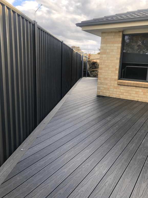 Charcoal composite side deck beside a Colorbond fence in Endeavour Hills, by Northern Star Painting