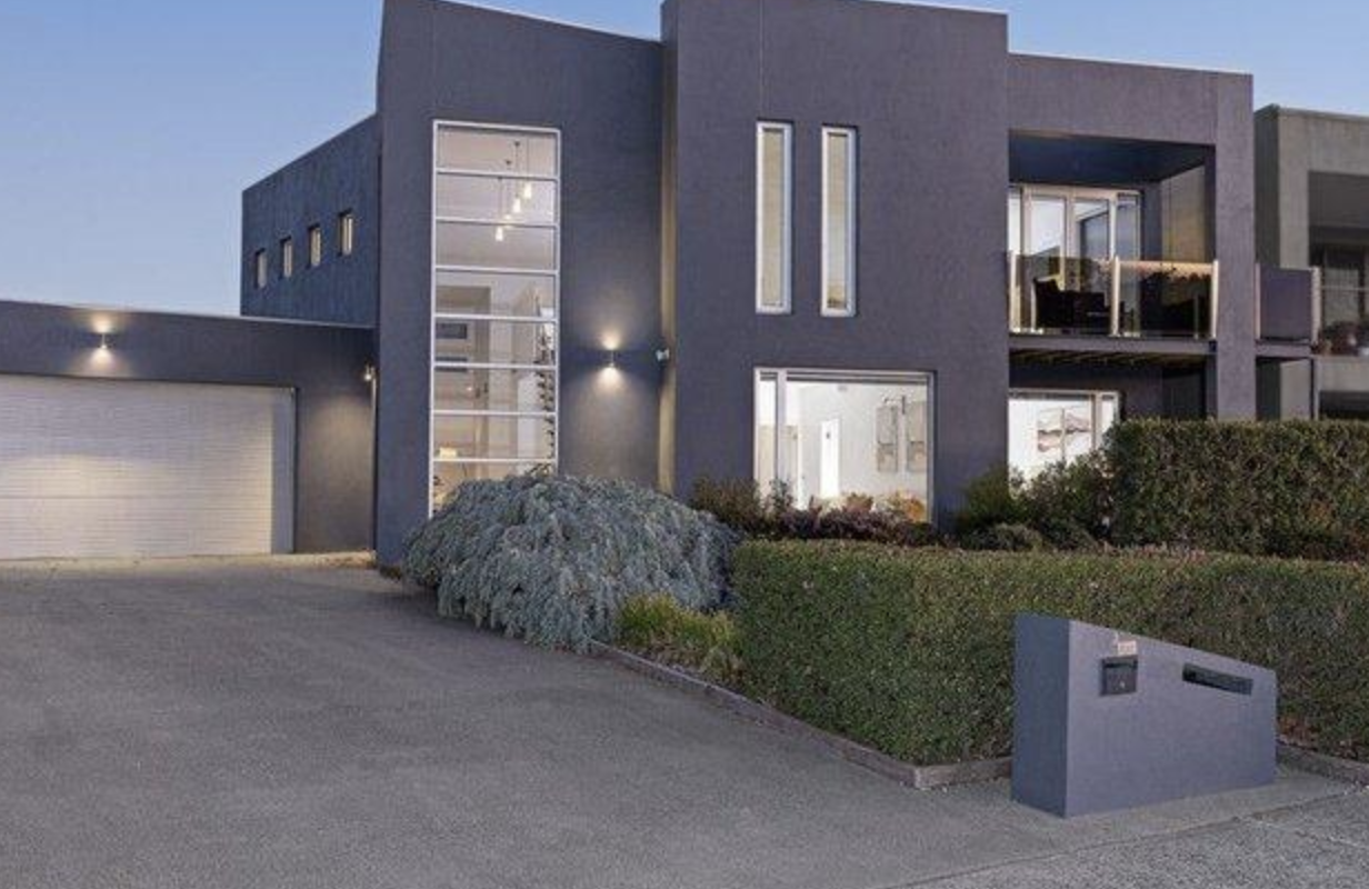 Rendered two-storey home in Berwick after exterior render painting in charcoal grey