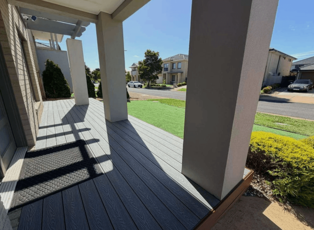 Grey front verandah deck between rendered columns in Harkaway, by Northern Star Painting