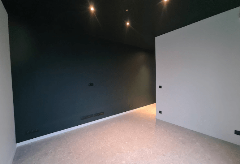 Modern interior painting featuring a deep charcoal accent wall in Pakenham by Northern Star Painting