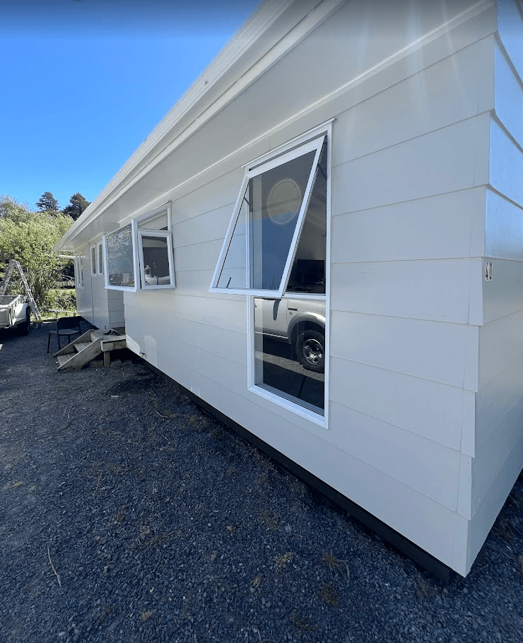 Fresh white weatherboard exterior paint job and window frame trim in Hallam by Northern Star Painting.